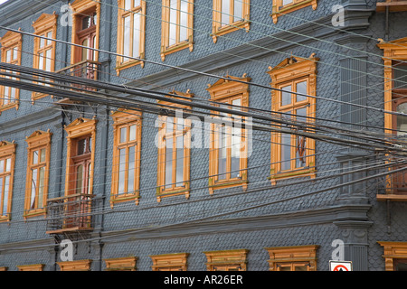 Valdivia Chile Building in old part of city showing windows and electricity cables Stock Photo