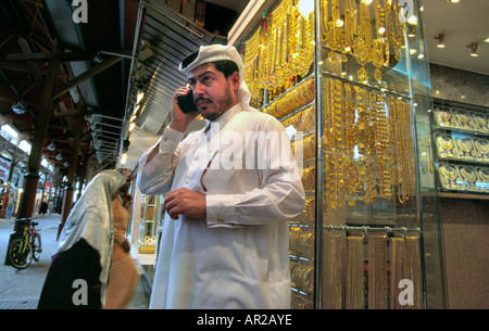UAE Dubai Gold Souk Arab businessman talking on mobile telephone Stock Photo