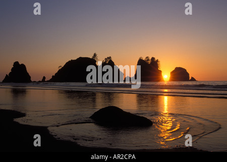 colorful silhouette of  sunset at Point of the Arches Shi Shi beach marine sanctuary on the Pacific coast Olympic National Park Washington state USA Stock Photo