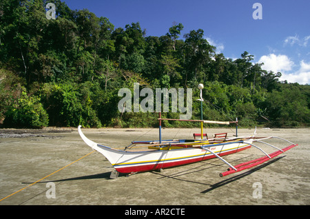 Philippines Palawan outrigger boat on beach near Sabang Stock Photo