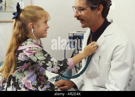 Doctor and young playful patient, physical exam, Miami Stock Photo