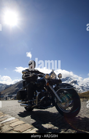 motorcyclist on high alpine road at the Grossglockner, on his way the the Bikers Point, Austria Stock Photo