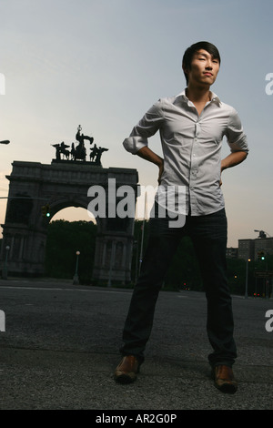 Asian Man posing outside in brooklyn Stock Photo