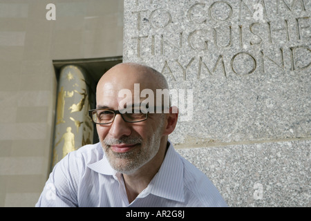 mature man with glasses looking at camera against memorial Stock Photo