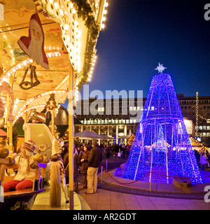 historical carousel and Christmas tree on Christmas market in citycenter, Germany, North Rhine-Westphalia, Ruhr Area, Essen Stock Photo