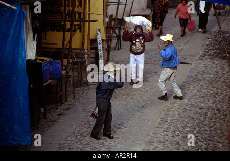 Two locals greet each other on market day in Chichicastenango, Guatemala, Central America. Stock Photo