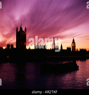 Dramatic silhouette of the Houses of Parliament skyline at sunset Westminster, London, England, Great Britain, UK, GB. London skyline. Dark clouds. Stock Photo