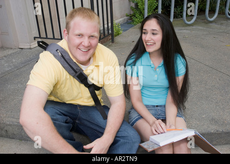 Young man and woman outside together Stock Photo