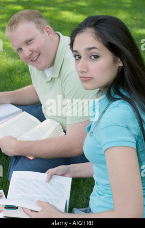 Two students studying together outdoors Stock Photo