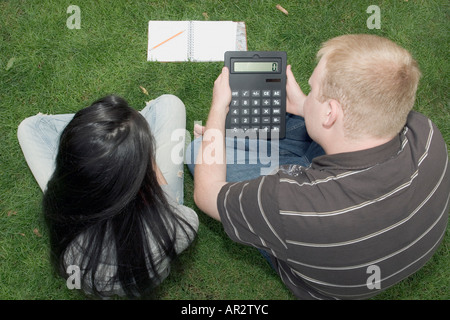 Two people students working together to solve problem Stock Photo