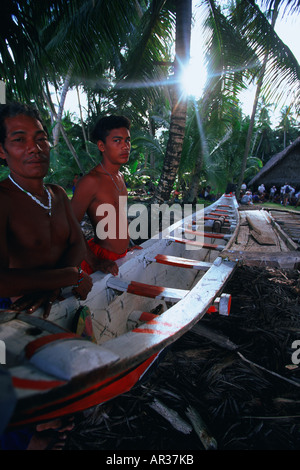 Men with outrigger canoe Ifalik Yap Micronesia Stock Photo