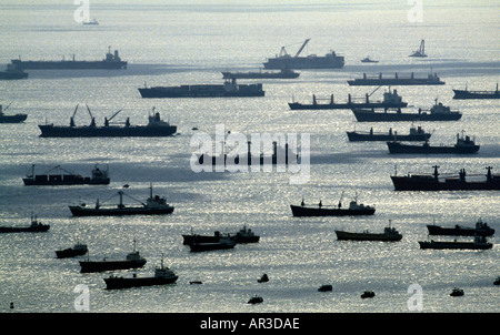 A aerial view shows ships waiting off shore of Singapore harbor waiting to dock Stock Photo