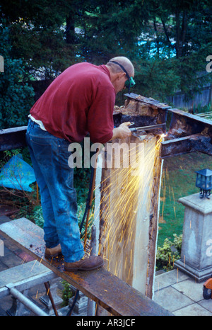 Demolishing Conservatory Man Cutting Iron Beam Wearing Protective Goggles Stock Photo