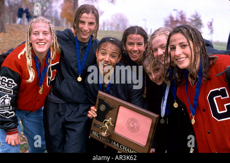 Central High cross country team age 17 with trophy celebrating win. Park Reserve Spring Lake Hastings Minnesota USA Stock Photo
