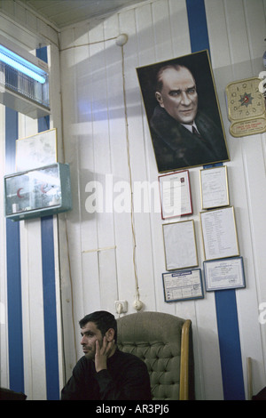 Man with portrait of Mustafa Kemal Atatuerk, Istanbul, Turkey Stock Photo