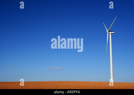 Large onshore horizontal axis three-bladed wind turbine, part of a wind farm to produce renewable energy Stock Photo