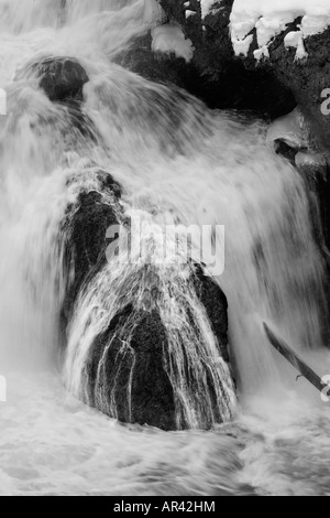 Yellowstone National Park Madison River waterfall rapids in winter snow and ice Stock Photo