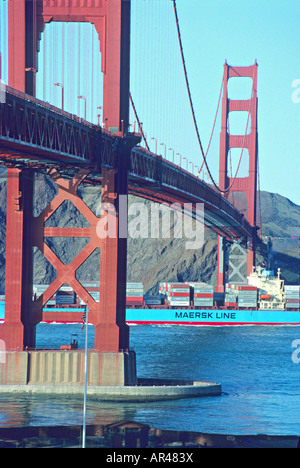 Container ship passing under Golden Gate Bridge, San Francisco, California Stock Photo
