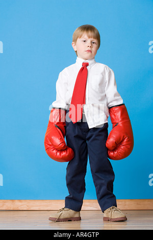 Boy wearing boxing gloves Stock Photo