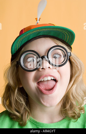 Girl wearing silly glasses and hat Stock Photo