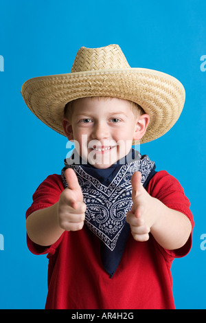 Boy dressed as cowboy Stock Photo