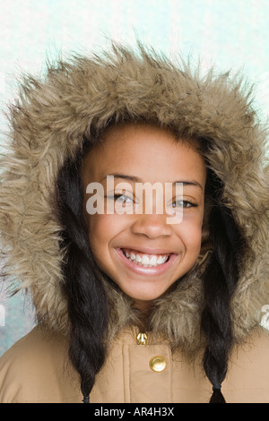 Girl wearing coat with furry hood Stock Photo