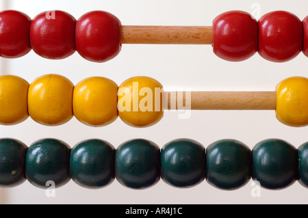 A close-up of a colorful abacus, a classic manual calculating tool constructed as a wooden frame with beads sliding on wires Stock Photo