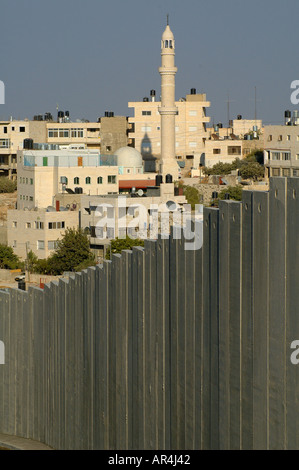 View of the Israeli West Bank separation barrier cutting through Abu Dis or Abu Deis a Palestinian community at the suburbs of East Jerusalem Israel Stock Photo