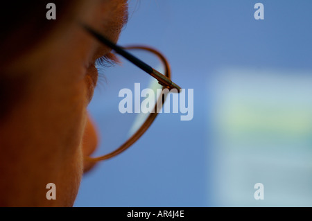 Man looking at a computer screen Stock Photo