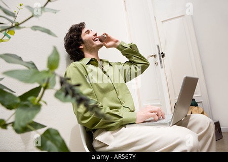 Man using cell phone Stock Photo
