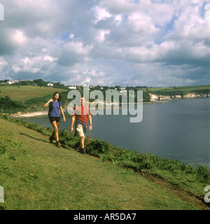 Young couple walking near Rosemullion Head near Falmouth in Cornwall in the United Kingdom Stock Photo