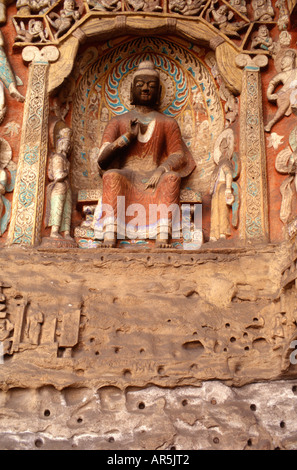 Buddhist statue at cave number 10 in the ancient rock cut Yungang Grottoes Buddhist temple from the 5th-6th centuries near the city of Datong in China Stock Photo