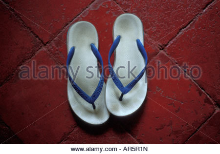 Worn out flip flops on man's feet Stock Photo: 14817713 - Alamy