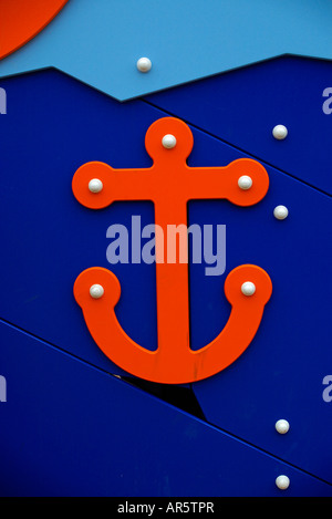 wooden red anchors on blue bottom in an infantile park Stock Photo