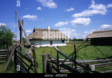 Budy, museum of Polish Village huts and well Stock Photo