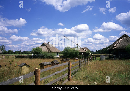 Budy, museum of Polish Village huts, beehives and well Stock Photo