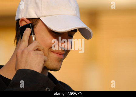 YOUNG MAN CALLING ON CELL PHONE Stock Photo