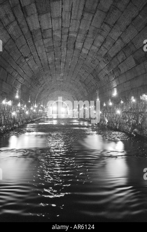 Phalen Creek storm sewer tunnel lit with candles and flashbulbs Stock Photo