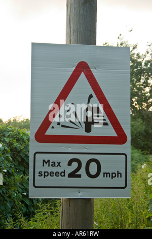 Loose chippings max speed 20mph road sign Stock Photo