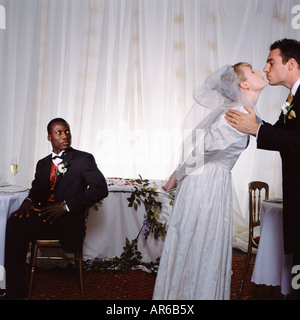 Groom kisses bride Stock Photo