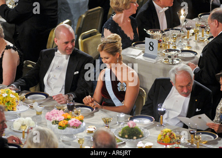 Princess Madeleine of Sweden chats with Swedens Prime Minister Fredrik Reinfeldt, left, at The Nobel Prize Gala Dinner Stock Photo