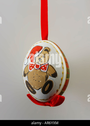 Artisan hand made Christmas snowman  tree bauble  decoration with a snowman design, against white Stock Photo
