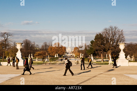 Early morning commuters walking through the Jardin des Tuileries, Paris, France Europe in the autumn Stock Photo