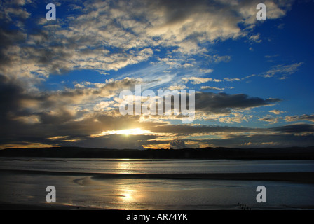 Sunset in a stormy sky at Arnside, Cumbria, part of Morecambe Bay Stock Photo