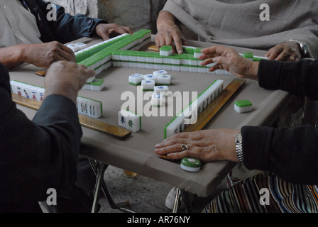 People playing Mahjong game Stock Photo