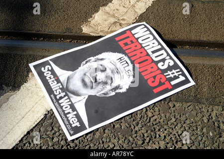 Discarded Anti Iraq war poster of US President George Bush on a rail track at anti war demo in Manchester England UK photo Don Tonge Stock Photo