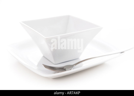 Place setting of white plate and bowl isolated on white background Stock Photo