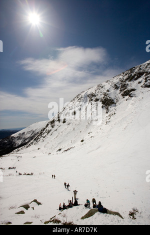 Skiers climbing Tuckerman Ravine in New Hampshire s White Mountains White Mountain National Forest April Stock Photo