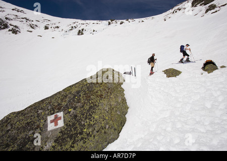 Skiers climbing Tuckerman Ravine in New Hampshire s White Mountains White Mountain National Forest April Stock Photo