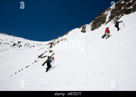 Skiers climbing Tuckerman Ravine in New Hampshire s White Mountains White Mountain National Forest April Stock Photo